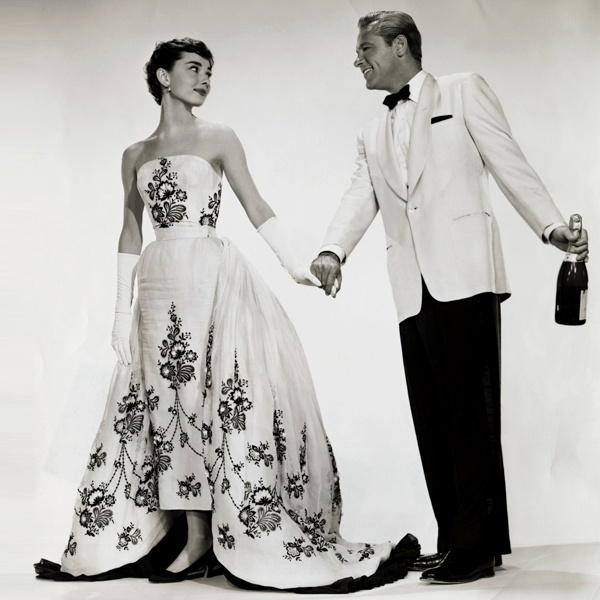 Audrey Hepburn wearing iconic black and white column evening gown with white bodice and black skirt from 1960s