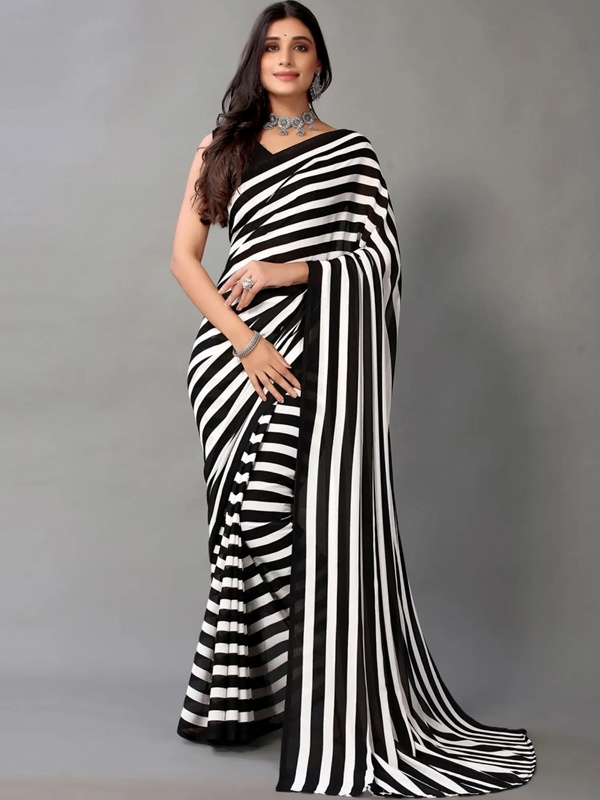 Traditional black and white bold vertical striped saree draped in classic Indian style