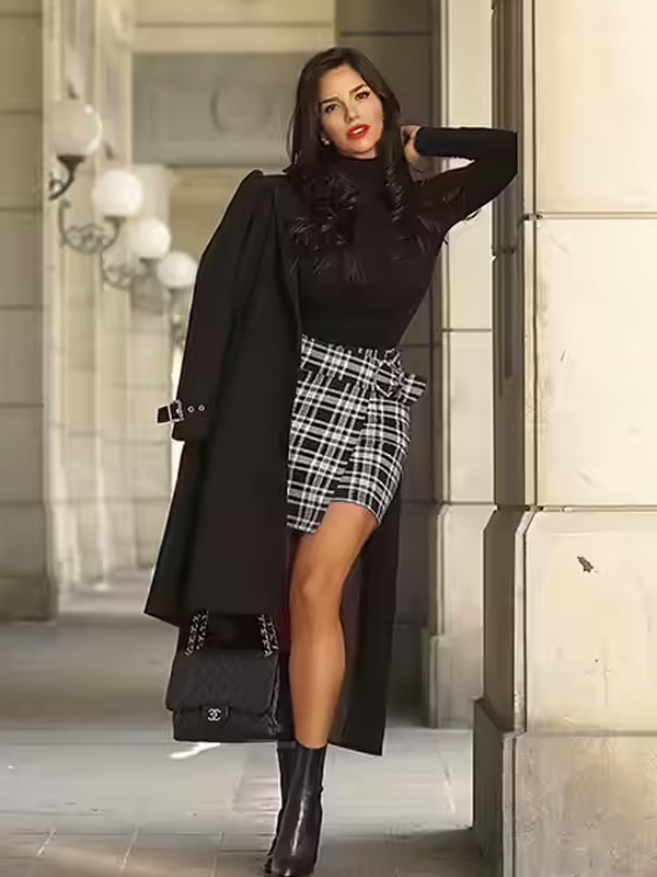 Stylish outfit with black turtleneck paired with black white plaid pencil skirt and black trench coat