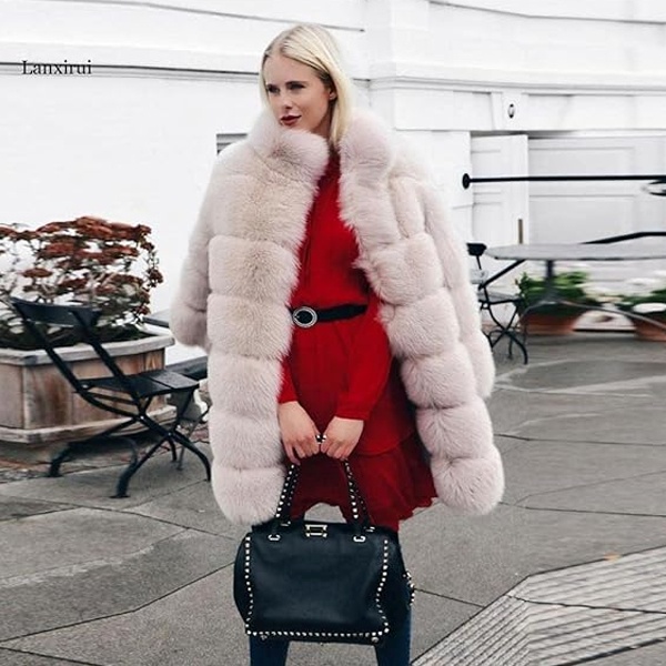 Luxurious beige faux fur jacket providing warmth and style for Christmas celebrations