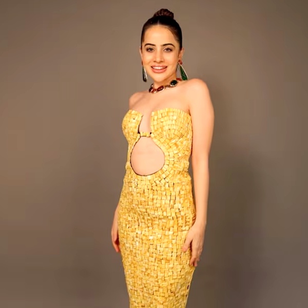 Bollywood actress Urfi Javed wearing unique costume made from recycled cigarette butts showcasing sustainable fashion statement Bollywood actress Urfi Javed wearing unique costume made from recycled cigarette butts showcasing sustainable fashion statement