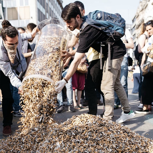 Environmental impact visualization of cigarette butt pollution and textile industry waste affecting sustainable fashion Environmental impact visualization of cigarette butt pollution and textile industry waste affecting sustainable fashion