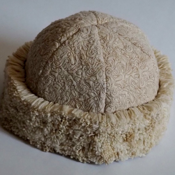 Designer Olivia Gino creates unique fuzzy hat fashion accessory from waste cigarette butts showcasing creative sustainable design Designer Olivia Gino creates unique fuzzy hat fashion accessory from waste cigarette butts showcasing creative sustainable design