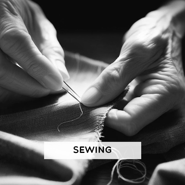 Primitive bone and ivory sewing needles used by early humans to stitch leather and vegetation into protective clothing