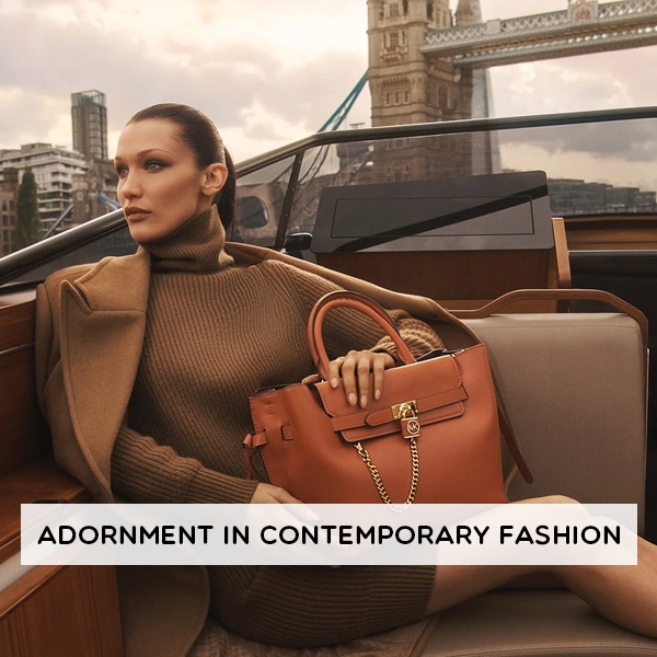 Contemporary fashion adornment through designer logos, luxury brands and limited-edition streetwear for status signaling Contemporary fashion adornment through designer logos, luxury brands and limited-edition streetwear for status signaling