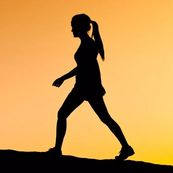 Designer taking refreshing evening walk outdoors to boost creativity and overcome mental blocks