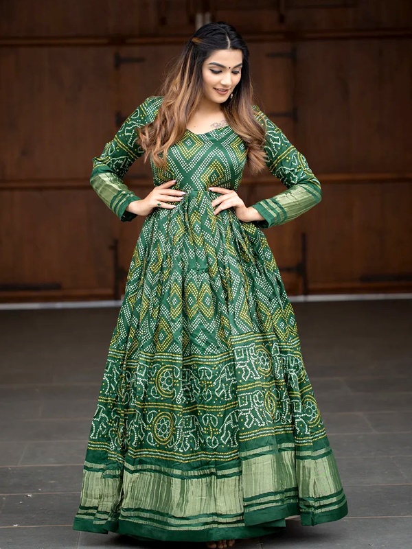 Green Gaji silk gown with digital bandhej prints and flared silhouette for Diwali Green Gaji silk gown with digital bandhej prints and flared silhouette for Diwali