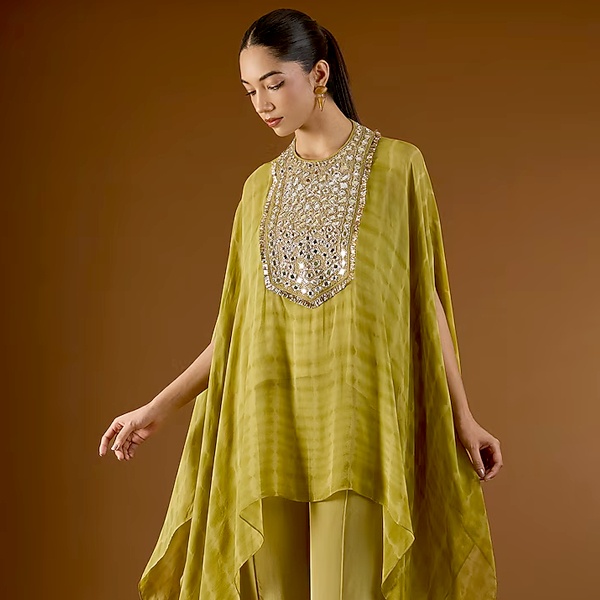 Olive green kaftan with vibrant mirror work embellishment for Diwali celebration 2026 Olive green kaftan with vibrant mirror work embellishment for Diwali celebration 2026