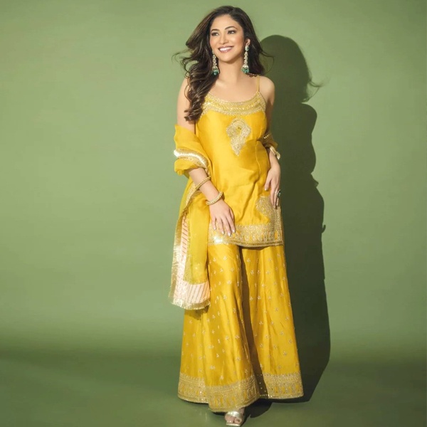 Yellow short kurta with flared sharara pants - comfortable Diwali outfit for women 2026 Yellow short kurta with flared sharara pants - comfortable Diwali outfit for women 2026