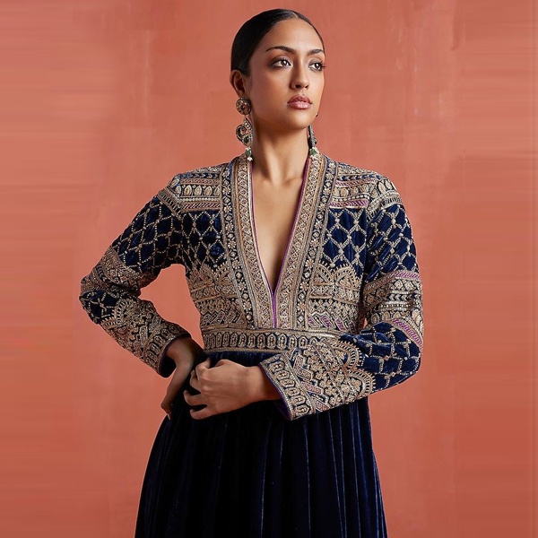 Fashion designers collaborating with local artisans demonstrating cultural appreciation in ethical design