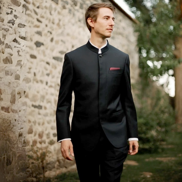 Chinese Mao suit with distinctive Mandarin collar gaining Western attention in late 1960's influencing global fashion with Chinese motifs dragons peonies and collar style in contemporary menswear