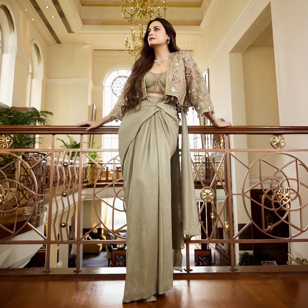 Dia Mirza wearing ethnic fusion outfit demonstrating Bollywood's role in popularizing traditional Indian handloom fabrics and embroidery with Western silhouettes creating modern Indo-Western wedding party fashion
