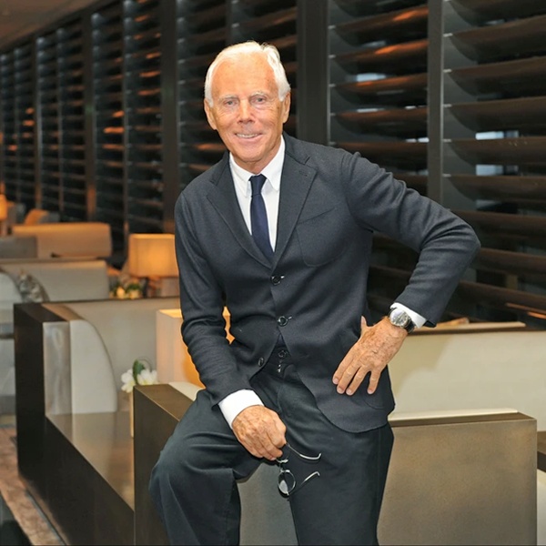 Giorgio Armani revolutionizing women's professional workwear in 1980 introducing soft tailoring by removing heavy padding from jackets creating elegant draping suits for successful businesswomen Giorgio Armani revolutionizing women's professional workwear in 1980 introducing soft tailoring by removing heavy padding from jackets creating elegant draping suits for successful businesswomen