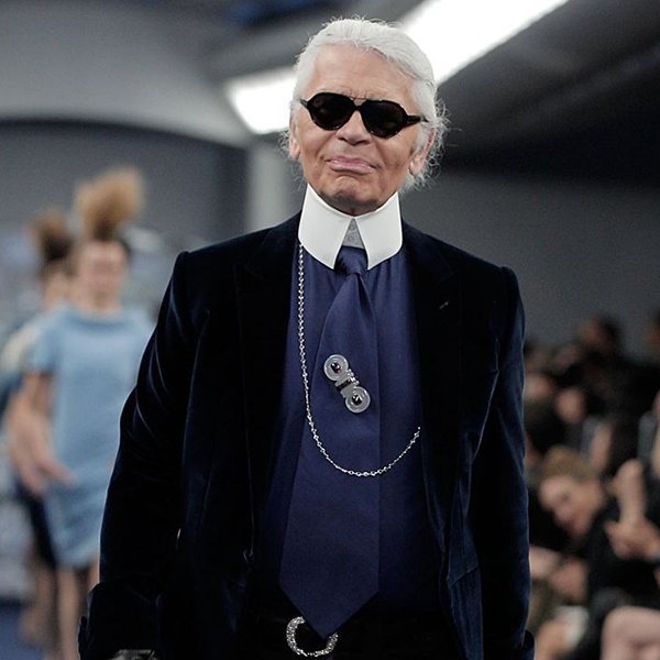 Karl Lagerfeld influential fashion designer entering industry through innovative rabbit and squirrel fur coats later revitalizing Chanel through perpetual reinvention maintaining brand identity across six decades Karl Lagerfeld influential fashion designer entering industry through innovative rabbit and squirrel fur coats later revitalizing Chanel through perpetual reinvention maintaining brand identity across six decades