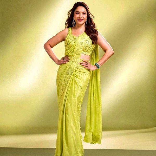 Madhuri Dixit iconic 1990's Bollywood fashion featuring flowing chiffon sarees in hit films shaping generational Indian fashion choices through cinema television and magazine editorial influence