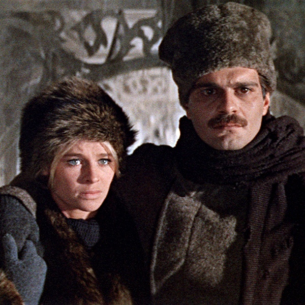 Julie Christie wearing iconic Russian-inspired winter fashion in 1965 film Doctor Zhivago featuring fur hats long military coats embroidered blouses and boots sparking global winter fashion revolution