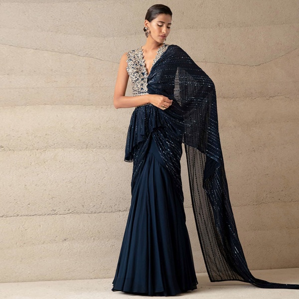 Indian traditional attire inspiring contemporary fusion fashion including saree gowns dhoti-style trousers kimono sleeves angarkha jackets and bandhgala coats blending heritage with modern silhouettes
