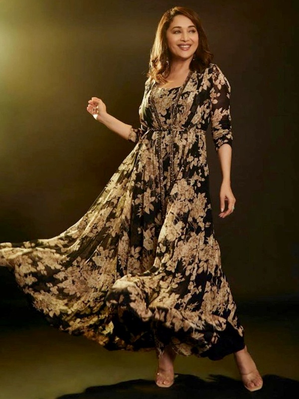 Madhuri Dixit wearing elegant black floral print cape set for sophisticated ethnic fashion look