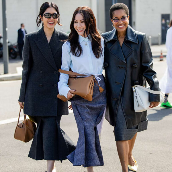 Women's business casual attire featuring smart tops chinos trousers and knee length skirts for modern office professional workplace settings