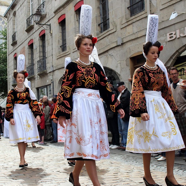 Women in European folk costumes during a cultural parade