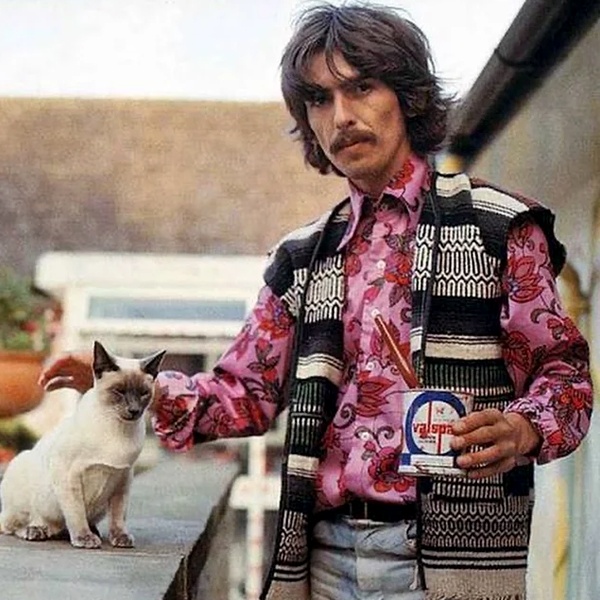 George Harrison wearing Indian-inspired hippie fashion with embroidered kurta, ethnic jacket and handcrafted accessories popularizing Eastern bohemian style George Harrison wearing Indian-inspired hippie fashion with embroidered kurta, ethnic jacket and handcrafted accessories popularizing Eastern bohemian style