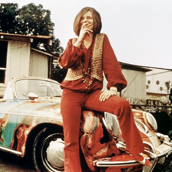 Janis Joplin iconic 1960s hippie fashion featuring bold psychedelic prints, layered beaded necklaces, oversized sunglasses, velvet and feathered accessories Janis Joplin iconic 1960s hippie fashion featuring bold psychedelic prints, layered beaded necklaces, oversized sunglasses, velvet and feathered accessories