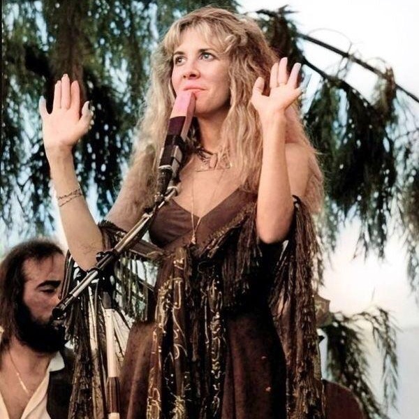 Stevie Nicks bohemian hippie fashion featuring flowing lace maxi skirts, layered shawls, platform boots and romantic gypsy-inspired styling Stevie Nicks bohemian hippie fashion featuring flowing lace maxi skirts, layered shawls, platform boots and romantic gypsy-inspired styling