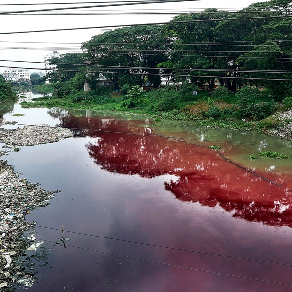Industrial waste water contaminated with toxic textile dyes, a major cause of water pollution from fast fashion manufacturing
