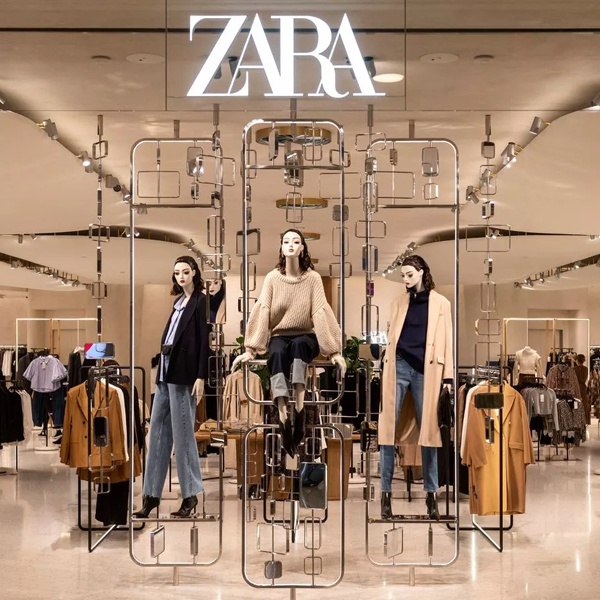 Zara and H & M fast fashion stores, symbolizing their significant contribution to 92 million tonnes of annual textile waste