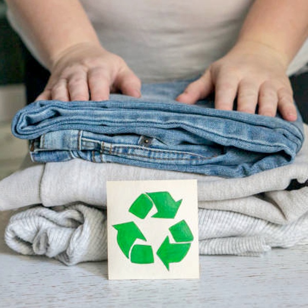 Sustainable fashion concept featuring eco-friendly fabrics, ethical production methods and circular fashion principles for environmental protection Sustainable fashion concept featuring eco-friendly fabrics, ethical production methods and circular fashion principles for environmental protection