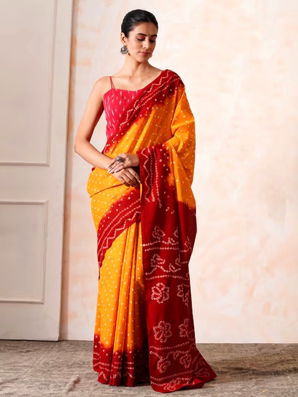 Red and yellow Bandhani tie-dye saree from Rajasthan with traditional dot patterns