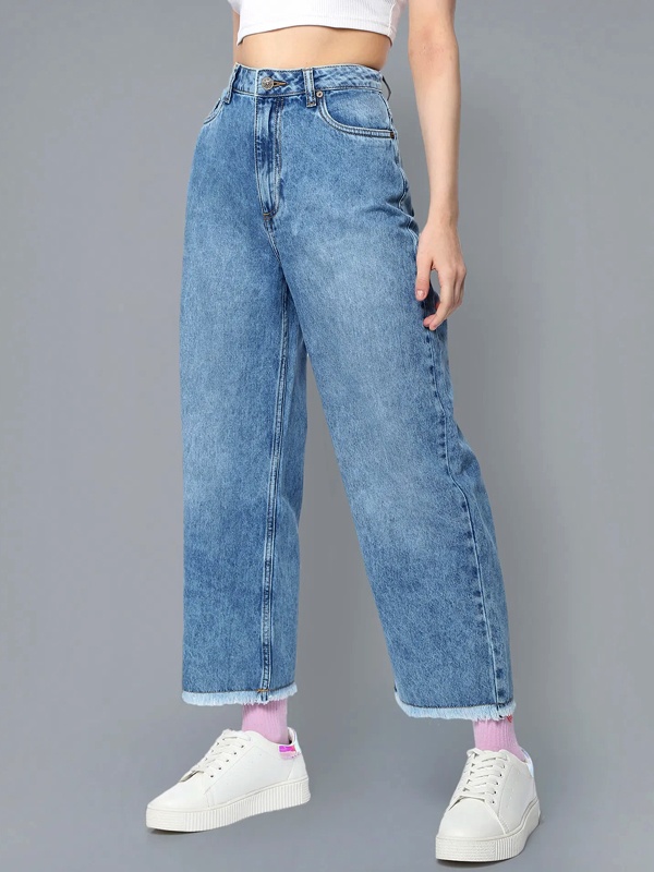 Acid washed denim with chemical bleach creating high contrast 80s style pattern