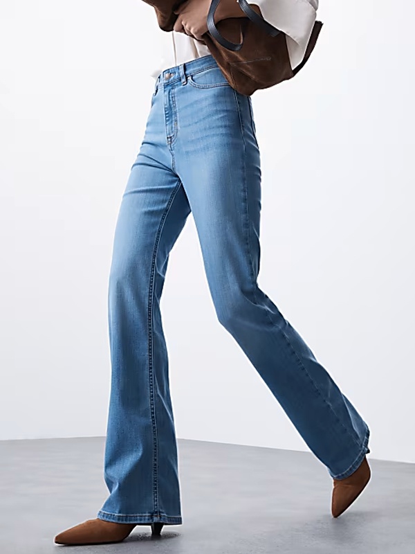 Flared bell bottom jeans with dramatic wide leg opening from knee down