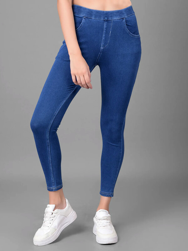 Full length view of blue jeggings with body hugging fit.