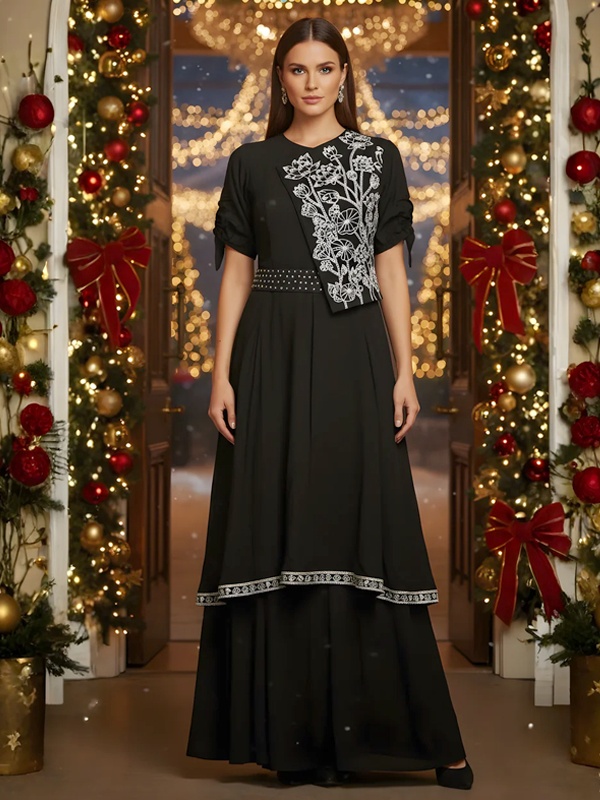 Black crepe gown featuring white floral thread embroidery on the shoulder, a waist belt and a layered hemline. Black crepe gown featuring white floral thread embroidery on the shoulder, a waist belt and a layered hemline.
