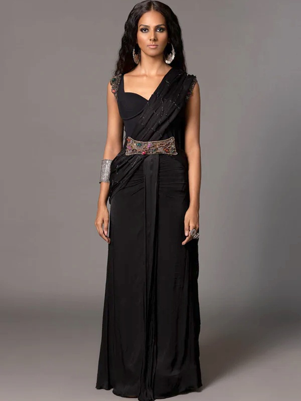 Black saree styled with metallic corset belt for contemporary waist definition and structured silhouette