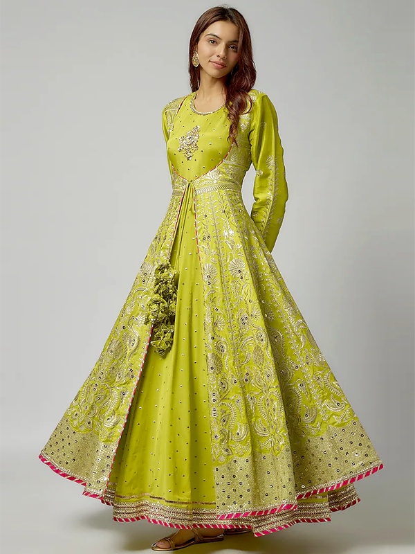 Lime green tussar jacket style kalidar anarkali with intricate silver thread embroidery and tassels. Lime green tussar jacket style kalidar anarkali with intricate silver thread embroidery and tassels.