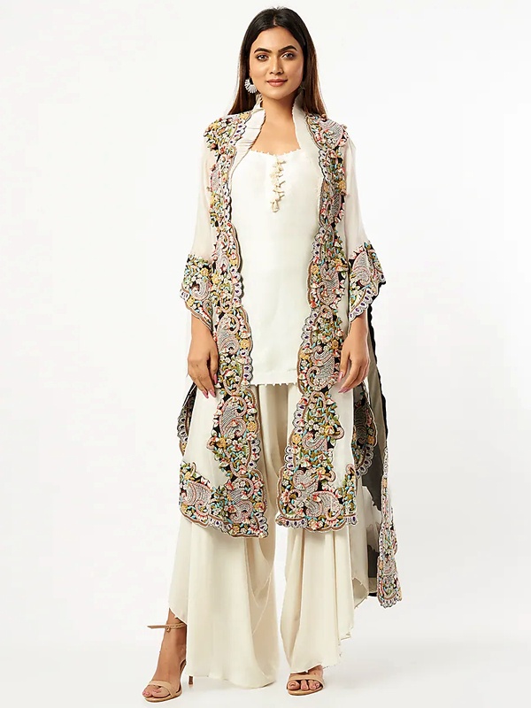 Ivory dupion silk short kurta set featuring an organza cape with colorful thread and pearl embroidery borders. Ivory dupion silk short kurta set featuring an organza cape with colorful thread and pearl embroidery borders.