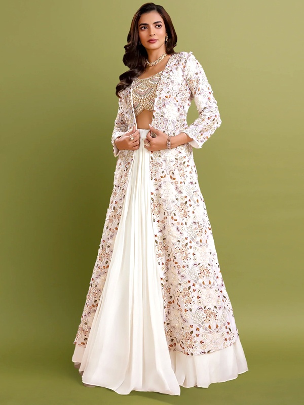 Floor-length ethnic jacket layered over crop top and lehenga skirt for modern Indian styling