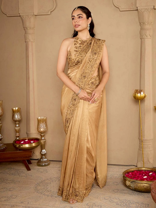 Antique gold pre-draped saree with structured silhouette perfect for wedding receptions and festive occasions