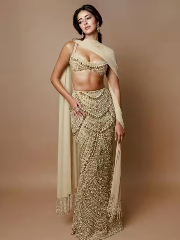Ananya Panday wearing beige embellished lehenga with bralette blouse and plain dupatta