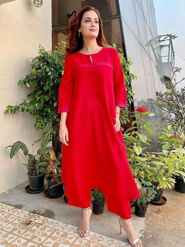 Dia Mirza wearing bright red asymmetric kurta with three quarter sleeves