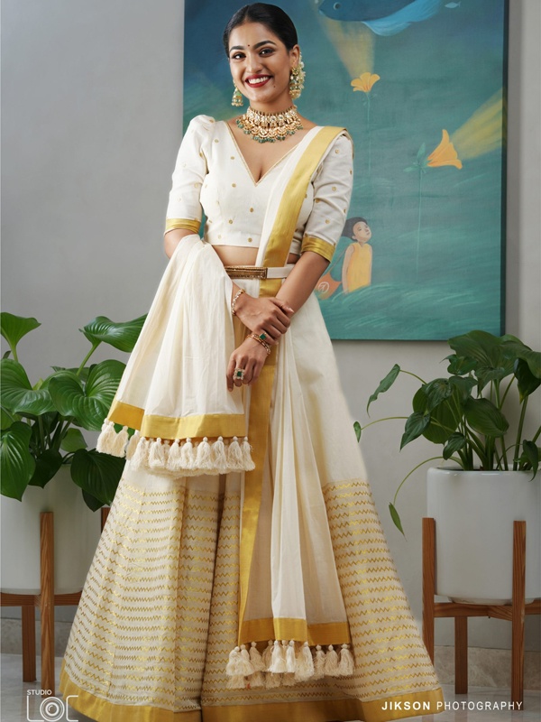 Saniya Iyappan in a cream and golden lehenga with gold detailing, paired with a white dupatta. Saniya Iyappan in a cream and golden lehenga with gold detailing, paired with a white dupatta.