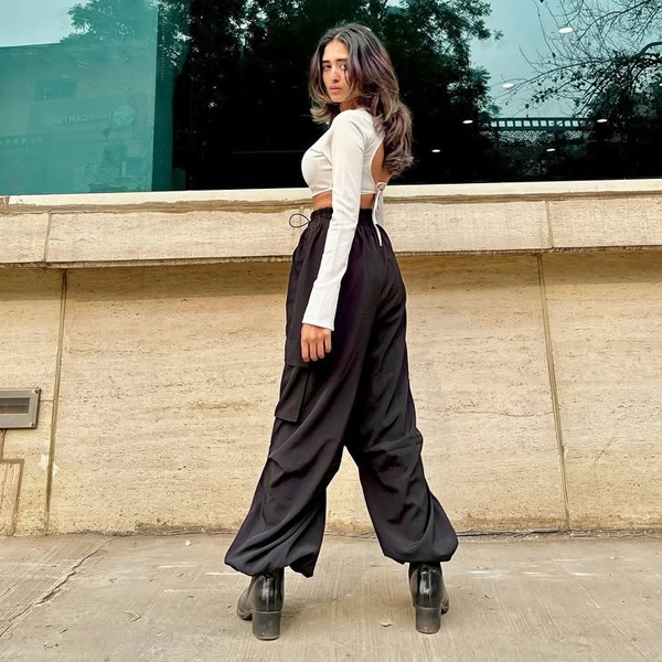 Fashion trend forecast showing parachute pants growth on college campuses from 2025 to 2027 with student styling predictions and color preferences