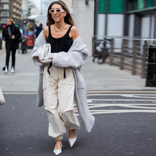 Seasonal styling guide for parachute pants showing layering techniques for warm and cool weather college campus wear