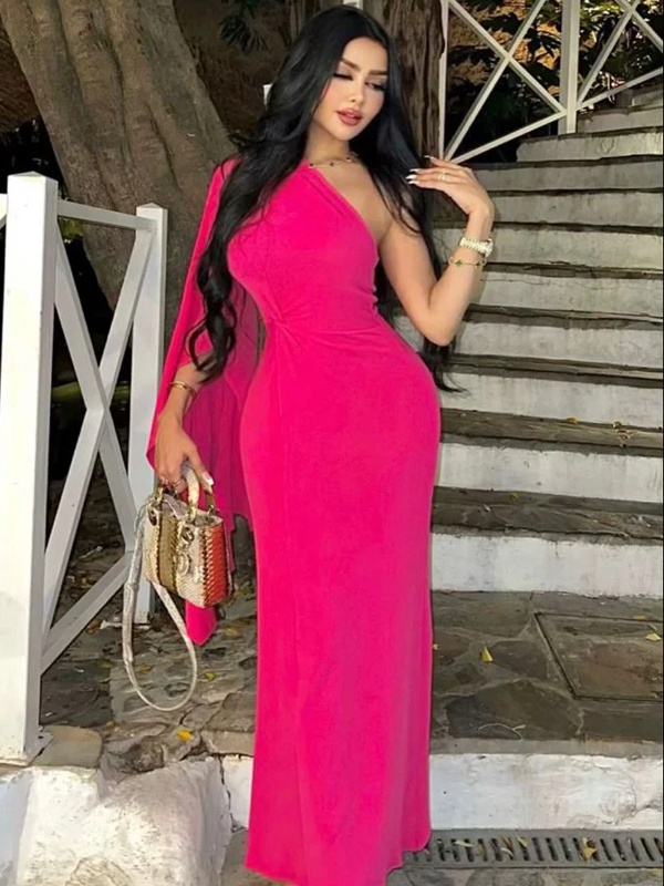 Hot pink one-shoulder sheath dress with dramatic cape sleeve for evening events