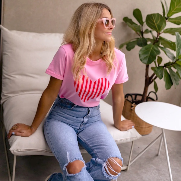 Pink t-shirt paired with blue denim jeans for effortless everyday casual wear