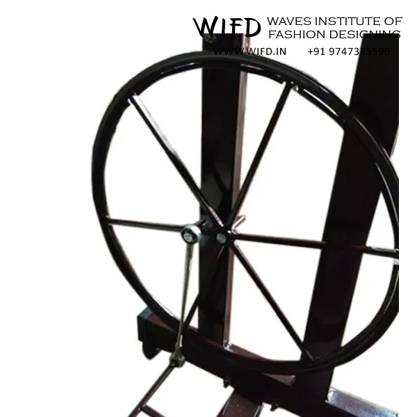 Drive wheel under machine table connected to hand wheel with belt