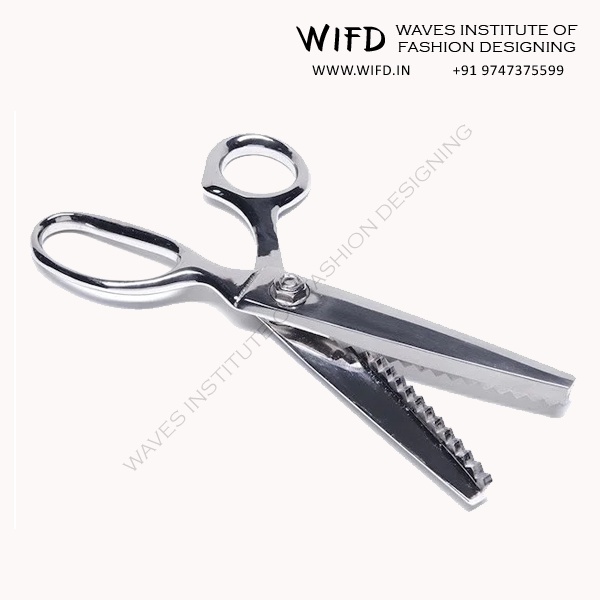 Pinking shears with notched zigzag blades for finishing raw fabric edges and preventing fraying
