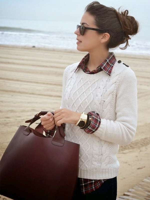 Business casual layered style multicolor plaid shirt under off-white textured patterned sleeveless sweater with black straight-leg pants and brown leather tote bag